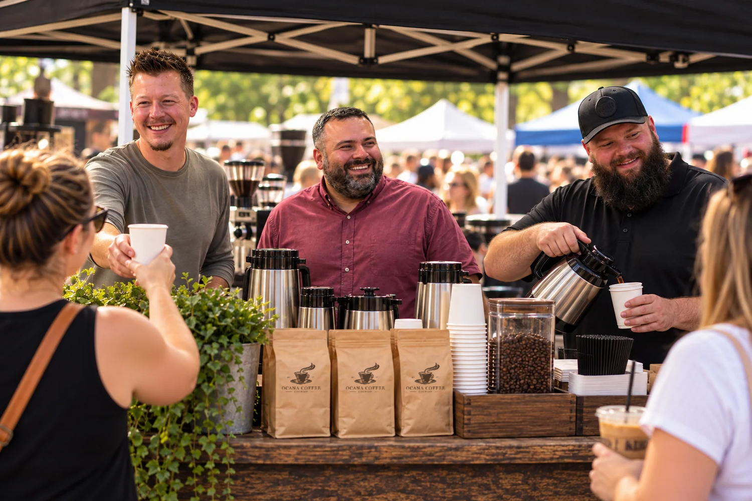 Ocana's three founders pouring coffee at a local market